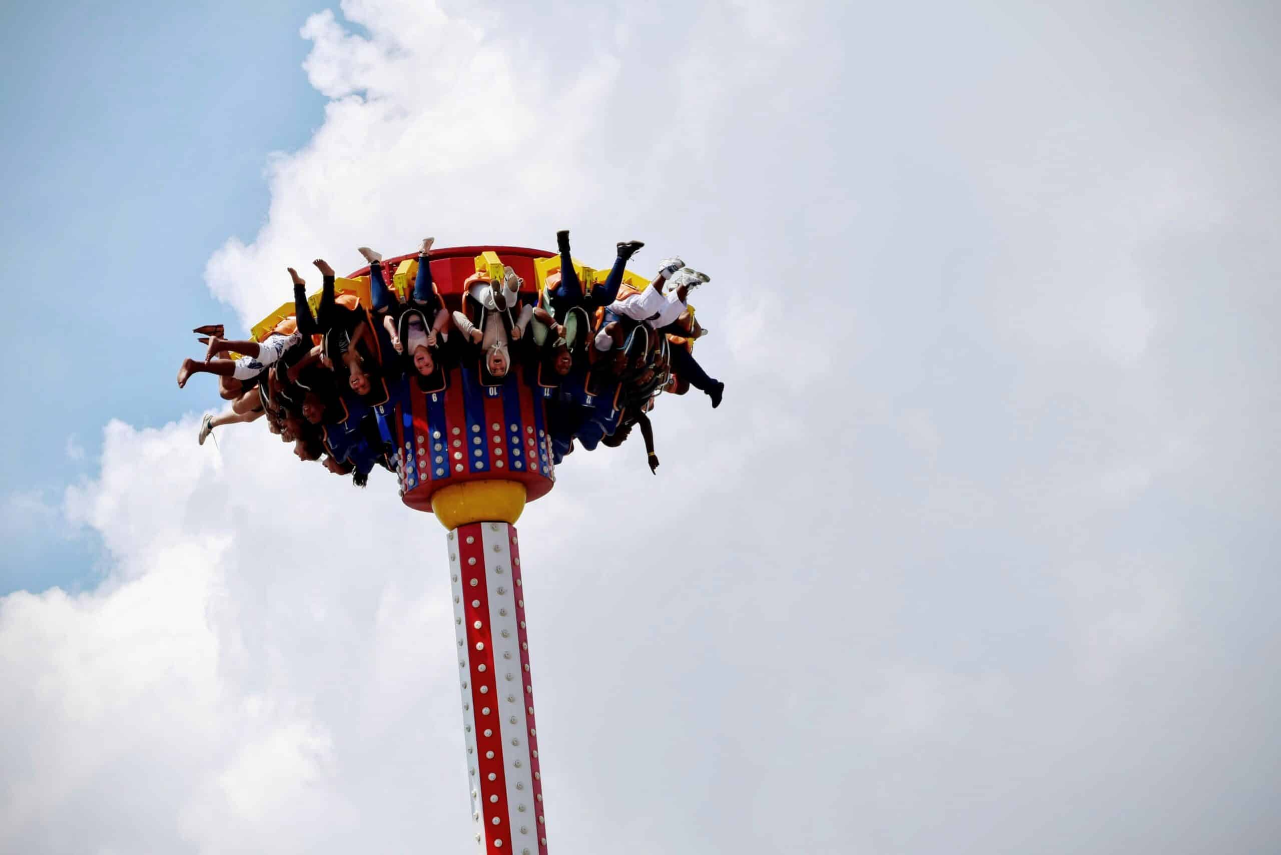 people riding on amusement park